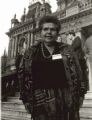 Shirley Smith on the steps of Town Hall in Sydney, several unknown people are in the background.